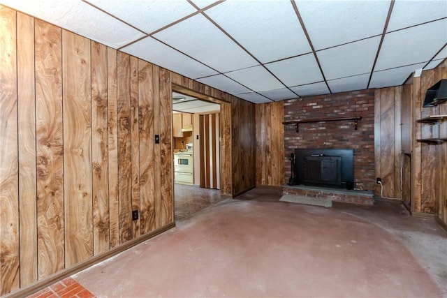 14 Meadow View Dr, Smithfield, RI 02917 - unfurnished living room with wood walls, a paneled ceiling, and concrete floors