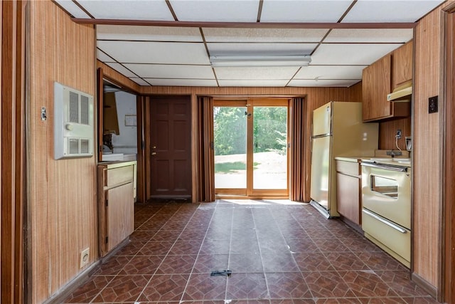 14 Meadow View Dr, Smithfield, RI 02917 - kitchen featuring stove, under cabinet range hood, light countertops, brown cabinetry, and wooden walls