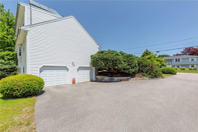 14 Meadow View Dr, Smithfield, RI 02917 - view of property exterior featuring asphalt driveway and a garage