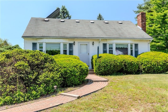 14 Meadow View Dr, Smithfield, RI 02917 - view of front of house featuring a chimney, a front lawn, and roof with shingles