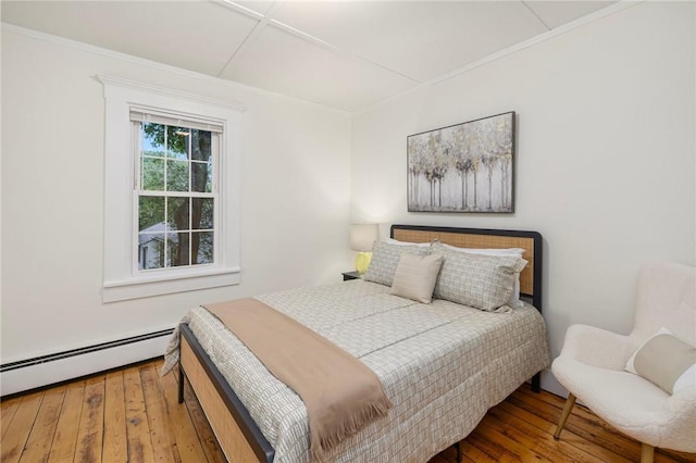 43 Cherry Ln Unit B, South Kingstown, RI 02879 - bedroom featuring baseboard heating, hardwood / wood-style flooring, and crown molding