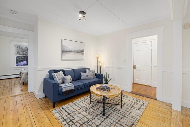 43 Cherry Ln Unit B, South Kingstown, RI 02879 - living area featuring light wood-style floors and a baseboard radiator