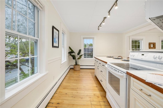 43 Cherry Ln Unit B, South Kingstown, RI 02879 - kitchen featuring electric stove, rail lighting, plenty of natural light, light wood finished floors, and ornamental molding
