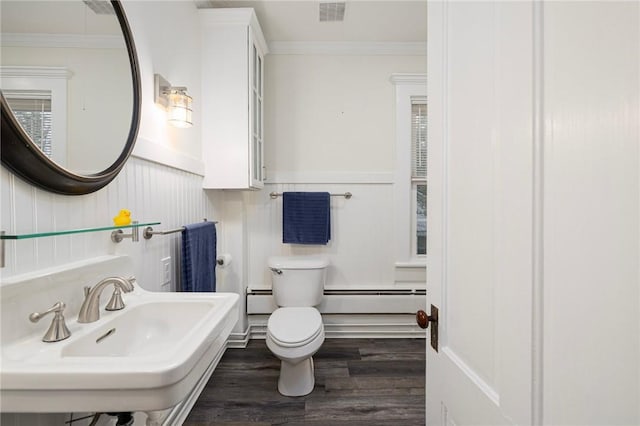 43 Cherry Ln Unit B, South Kingstown, RI 02879 - half bath with a baseboard heating unit, crown molding, wood finished floors, a decorative wall, and baseboard heating