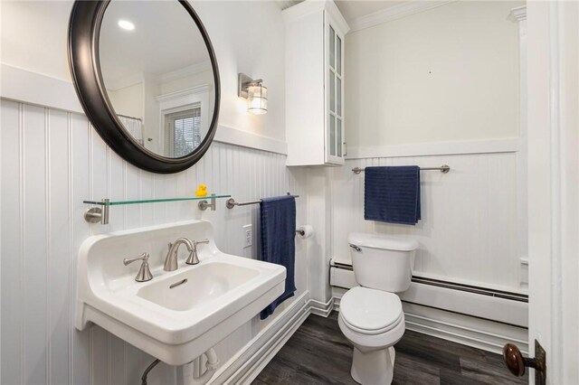 43 Cherry Ln Unit B, South Kingstown, RI 02879 - bathroom featuring a baseboard radiator, ornamental molding, wainscoting, and wood finished floors