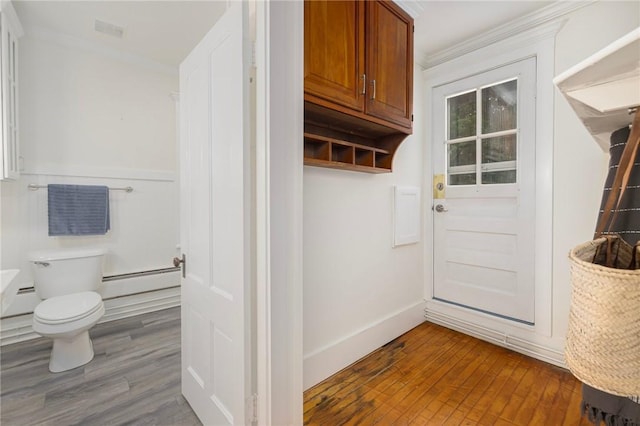 43 Cherry Ln Unit B, South Kingstown, RI 02879 - mudroom with a baseboard heating unit, crown molding, and dark wood-style floors