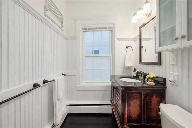 43 Cherry Ln Unit B, South Kingstown, RI 02879 - bathroom featuring vanity, a decorative wall, and wainscoting