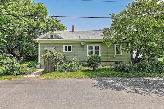 129 Ash St, Warwick, RI 02888 - view of property exterior featuring a chimney