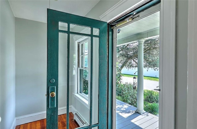 129 Ash St, Warwick, RI 02888 - doorway featuring healthy amount of natural light, wood finished floors, ornate columns, and baseboard heating
