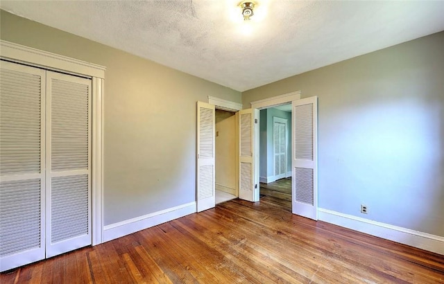 129 Ash St, Warwick, RI 02888 - unfurnished bedroom featuring hardwood / wood-style flooring and a closet