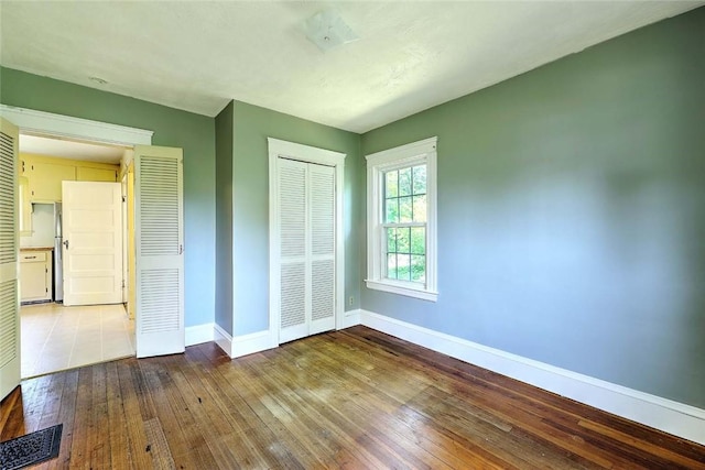 129 Ash St, Warwick, RI 02888 - unfurnished bedroom featuring hardwood / wood-style floors and a closet