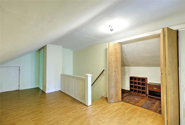 129 Ash St, Warwick, RI 02888 - additional living space featuring wood finished floors and vaulted ceiling