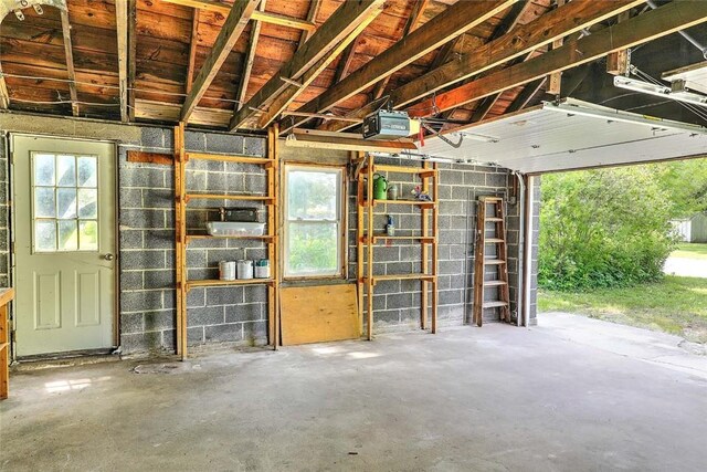 129 Ash St, Warwick, RI 02888 - garage featuring a garage door opener