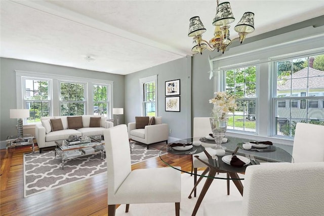 129 Ash St, Warwick, RI 02888 - living area with wood finished floors and a chandelier