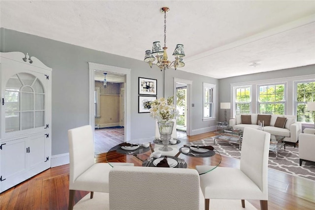 129 Ash St, Warwick, RI 02888 - dining space with wood finished floors and a chandelier
