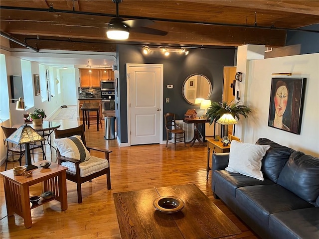 494 Woonasquatucket Ave Unit 304, North Providence, RI 02911 - living area featuring light wood-type flooring and beamed ceiling