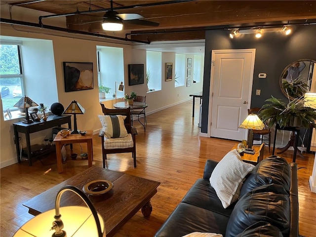 494 Woonasquatucket Ave Unit 304, North Providence, RI 02911 - living area featuring track lighting, light wood-style flooring, beamed ceiling, and a ceiling fan