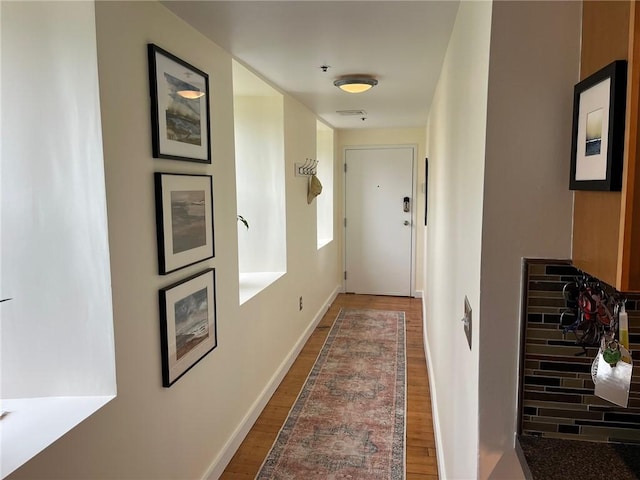 494 Woonasquatucket Ave Unit 304, North Providence, RI 02911 - hall featuring dark wood finished floors and baseboards