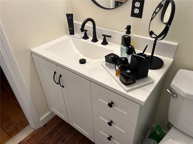 494 Woonasquatucket Ave Unit 304, North Providence, RI 02911 - bathroom featuring vanity and wood finished floors