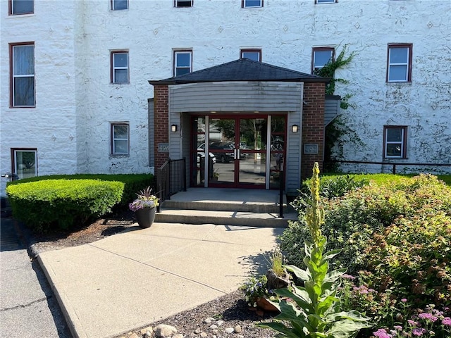494 Woonasquatucket Ave Unit 304, North Providence, RI 02911 - entrance to property featuring stucco siding and french doors