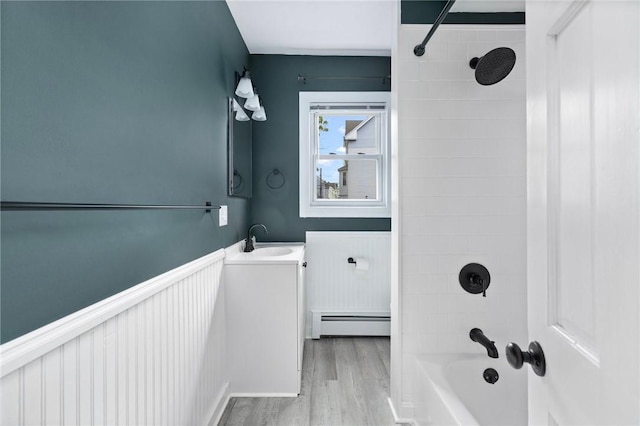122 Willow St, Providence, RI 02909 - full bathroom with baseboard heating, vanity, wood finished floors, bathing tub / shower combination, and a wainscoted wall
