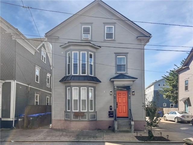 122 Willow St, Providence, RI 02909 - view of front of house featuring entry steps, a metal roof, and a standing seam roof