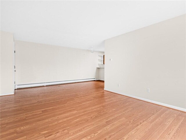 4430 Post Rd Unit 68E, Warwick, RI 02818 - unfurnished room with baseboard heating and light wood finished floors