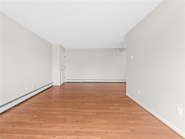 4430 Post Rd Unit 68E, Warwick, RI 02818 - empty room featuring light wood-style flooring and baseboard heating