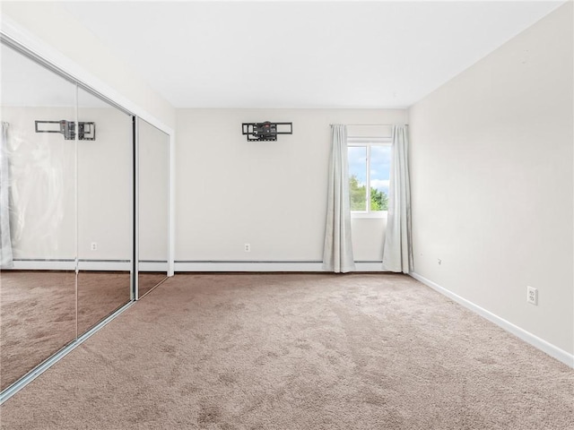 4430 Post Rd Unit 68E, Warwick, RI 02818 - unfurnished bedroom featuring carpet and a closet
