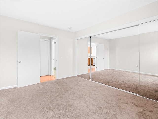 4430 Post Rd Unit 68E, Warwick, RI 02818 - unfurnished bedroom featuring carpet floors and a closet