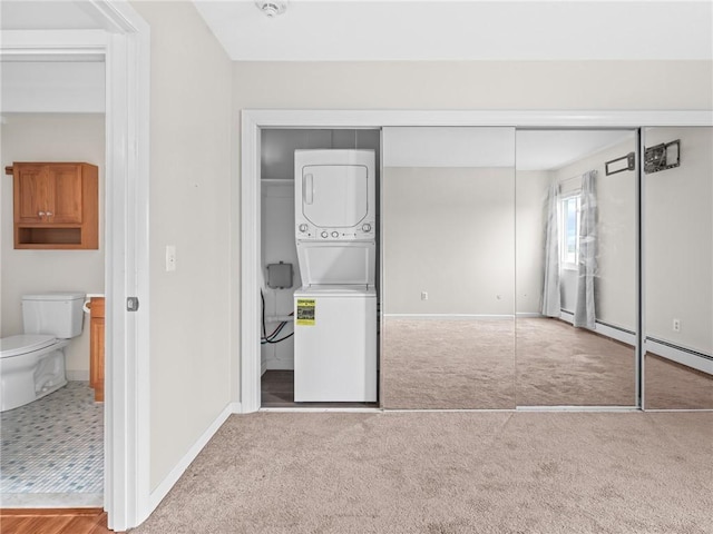 4430 Post Rd Unit 68E, Warwick, RI 02818 - unfurnished bedroom featuring estacked washer and dryer, carpet floors, and a closet