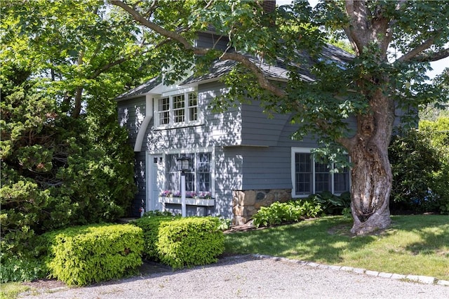 121 Avondale Rd, Westerly, RI 02891 - view of home's exterior with a chimney and stone siding