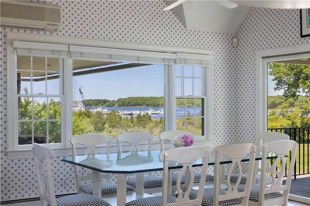 121 Avondale Rd, Westerly, RI 02891 - dining space featuring an AC wall unit and a water view