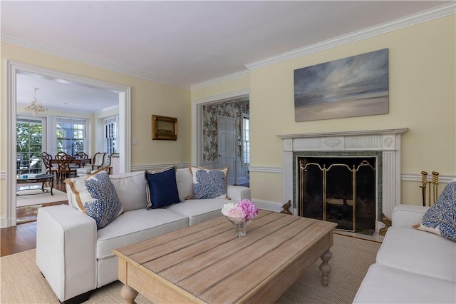 121 Avondale Rd, Westerly, RI 02891 - living area with ornamental molding, a premium fireplace, wood finished floors, and a chandelier