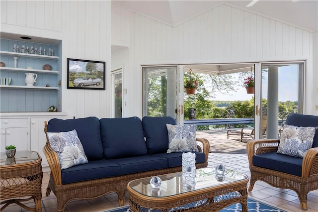 121 Avondale Rd, Westerly, RI 02891 - tiled living area with vaulted ceiling and wood walls