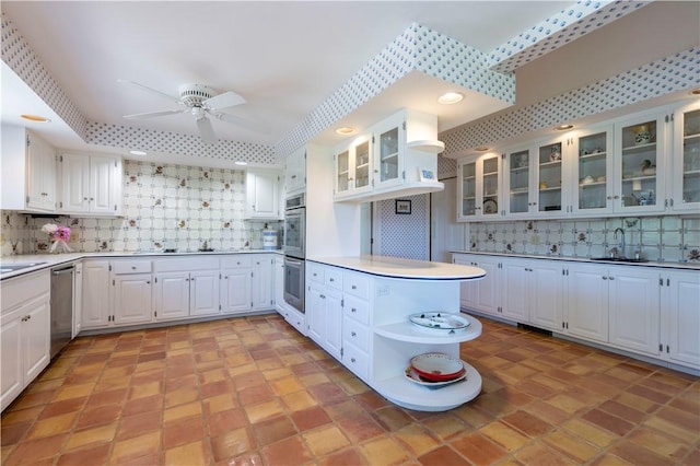 121 Avondale Rd, Westerly, RI 02891 - kitchen with open shelves, appliances with stainless steel finishes, a ceiling fan, a peninsula, and decorative backsplash
