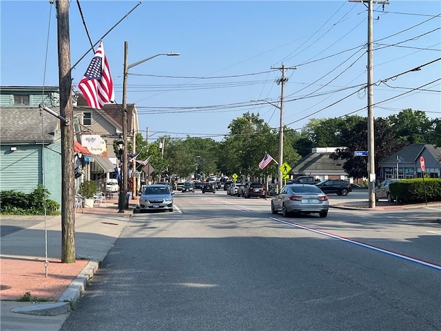 19 Remington St, Warwick, RI 02888 - view of asphalt road featuring street lights, curbs, sidewalks, and traffic signs