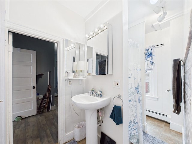 19 Remington St, Warwick, RI 02888 - bathroom with baseboard heating and a shower with shower curtain