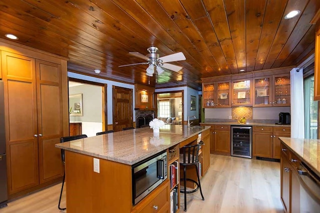 30 Karen Ann Dr, Smithfield, RI 02917 - kitchen with wine cooler, stainless steel appliances, wooden ceiling, a breakfast bar, and light wood finished floors