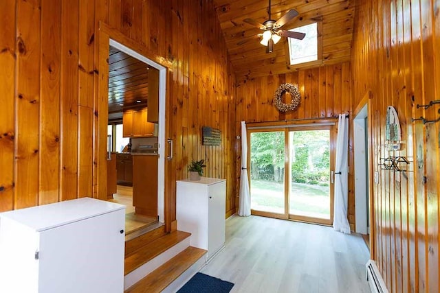 30 Karen Ann Dr, Smithfield, RI 02917 - doorway with a skylight, wooden walls, a ceiling fan, a baseboard heating unit, and high vaulted ceiling