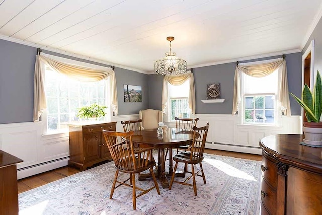 30 Karen Ann Dr, Smithfield, RI 02917 - dining room featuring a baseboard radiator, wood finished floors, crown molding, a chandelier, and a wainscoted wall