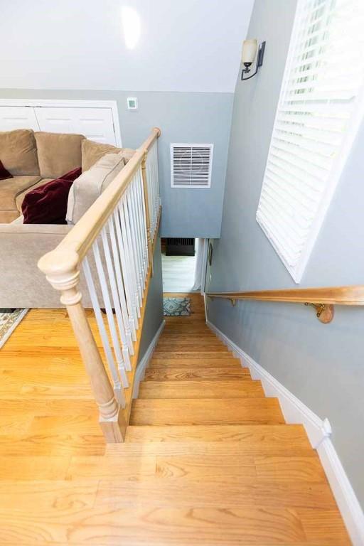 30 Karen Ann Dr, Smithfield, RI 02917 - stairs featuring wood finished floors and baseboards