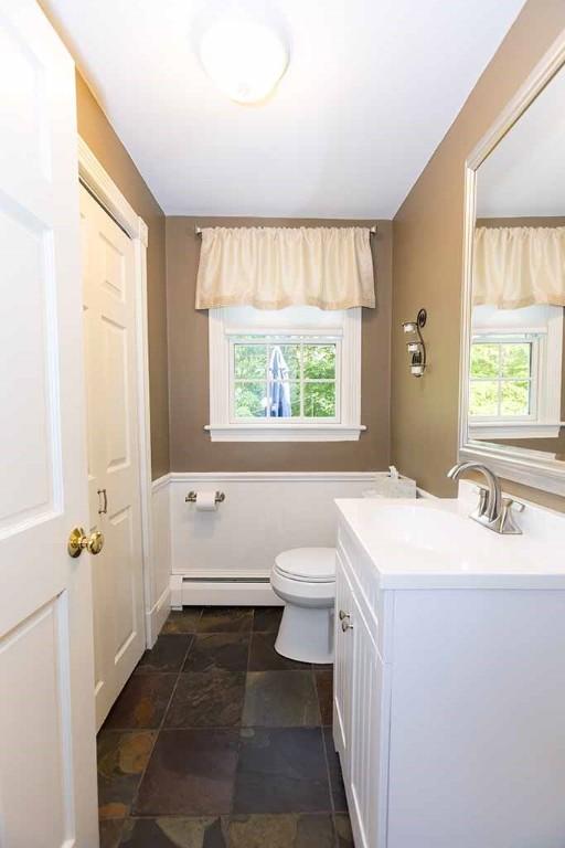 30 Karen Ann Dr, Smithfield, RI 02917 - bathroom featuring baseboard heating, healthy amount of natural light, and vanity