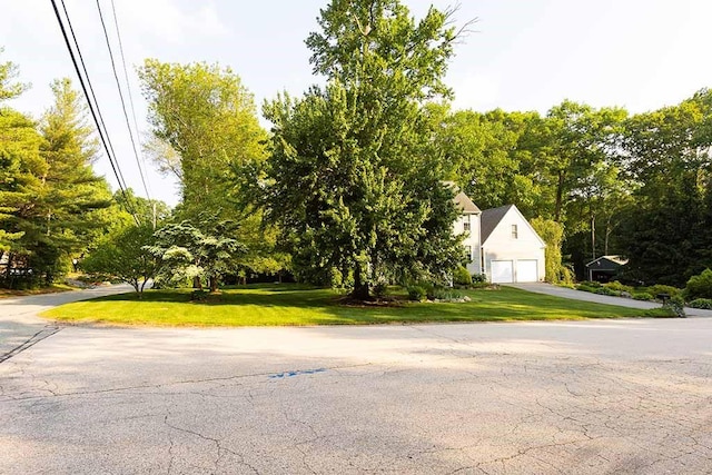 30 Karen Ann Dr, Smithfield, RI 02917 - view of property hidden behind natural elements with a detached garage and a front yard