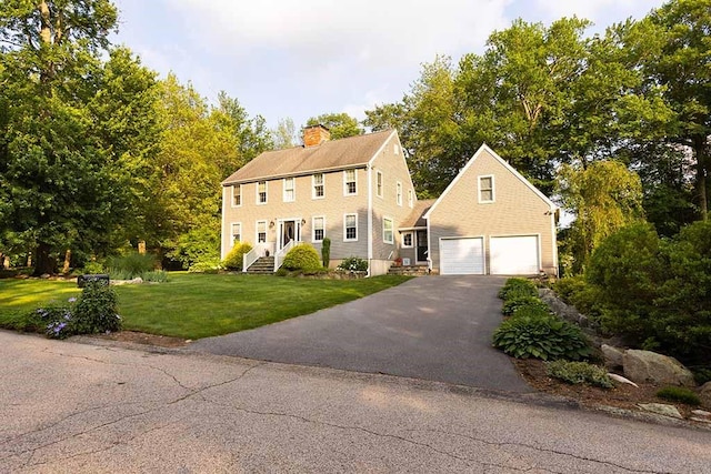 30 Karen Ann Dr, Smithfield, RI 02917 - colonial-style house with a chimney, a front yard, and driveway