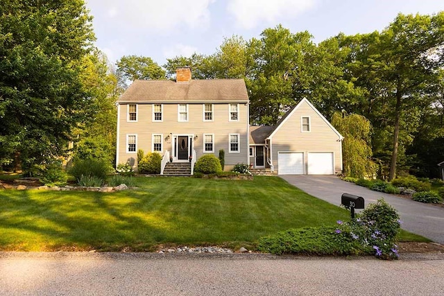 30 Karen Ann Dr, Smithfield, RI 02917 - colonial house with a chimney, driveway, and a front yard