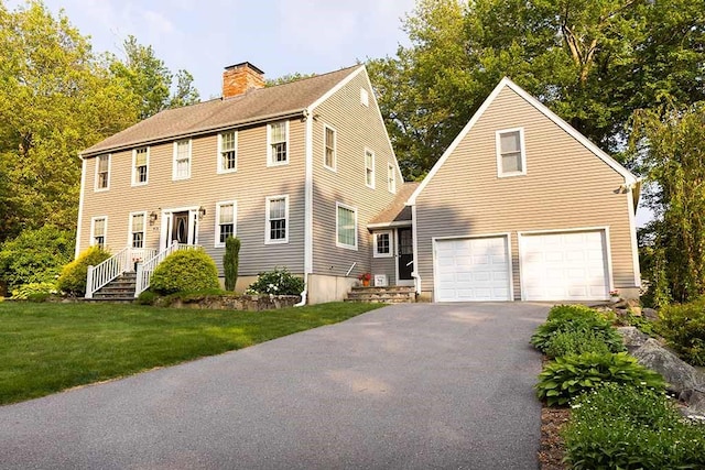 30 Karen Ann Dr, Smithfield, RI 02917 - colonial inspired home featuring driveway, a chimney, an attached garage, and a front lawn