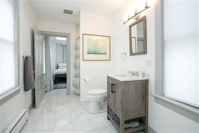 12 Poplar St, Newport, RI 02840 - bathroom with a baseboard heating unit, vanity, marble look tiles, and healthy amount of natural light