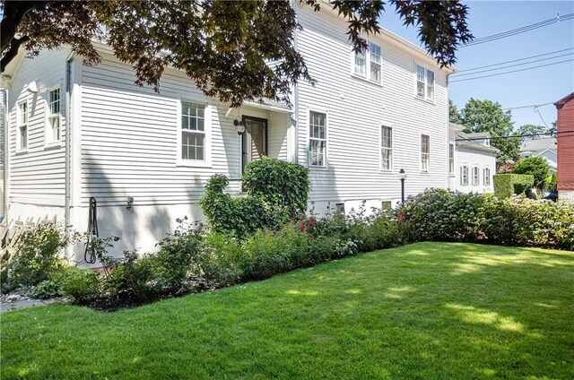12 Poplar St, Newport, RI 02840 - view of side of home with a lawn