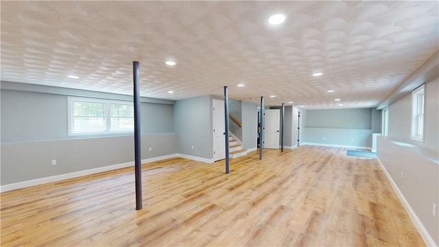 112 Cranberry Ridge Rd, Glocester, RI 02857 - below grade area featuring stairs, light wood-type flooring, and recessed lighting